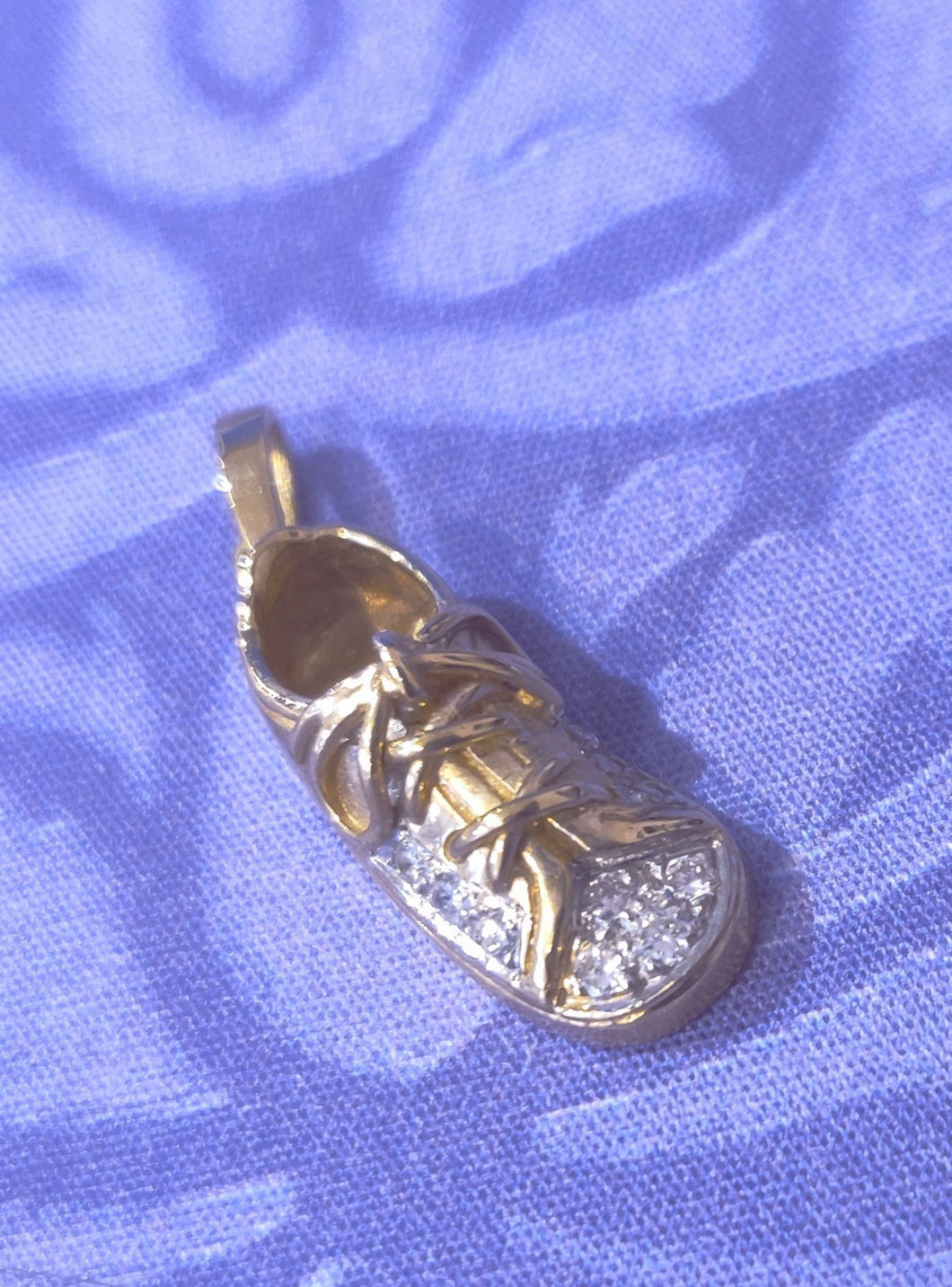 Gold and diamond running shoe pendant
