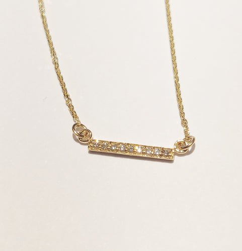 Petite bar necklace with diamonds in yellow gold